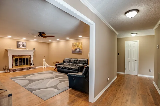 a kitchen with granite countertop a refrigerator and a sink