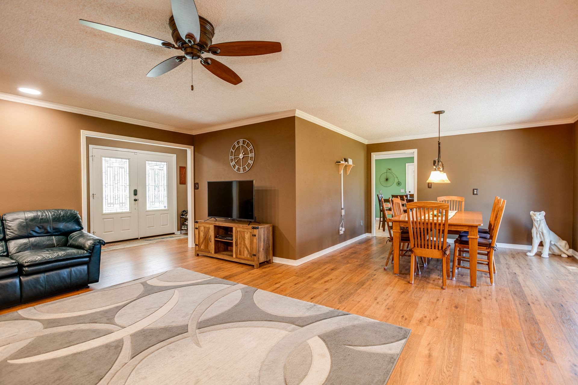 2743 Mouse Tail Road Parsons, TN 38363 - Photo 7 of 79 a dining room with wooden floor and a chandelier