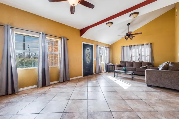 a living room with furniture and a window