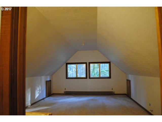 40181 Booth Kelly Road Springfield, OR 97478 - Photo 10 of 17 a view of a hallway with wooden floor and a window