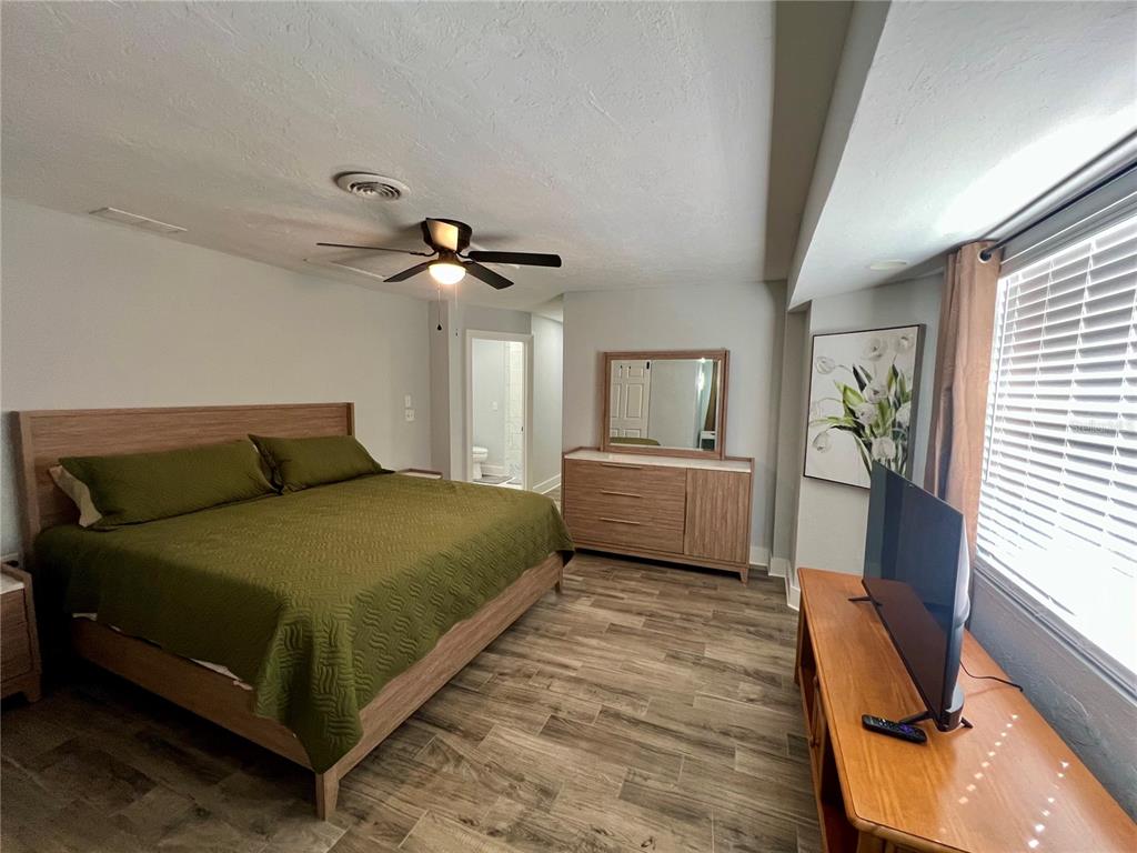 112 Rose Street Venice, FL 34293 - Photo 17 of 33 a bedroom with a bed window and a couch