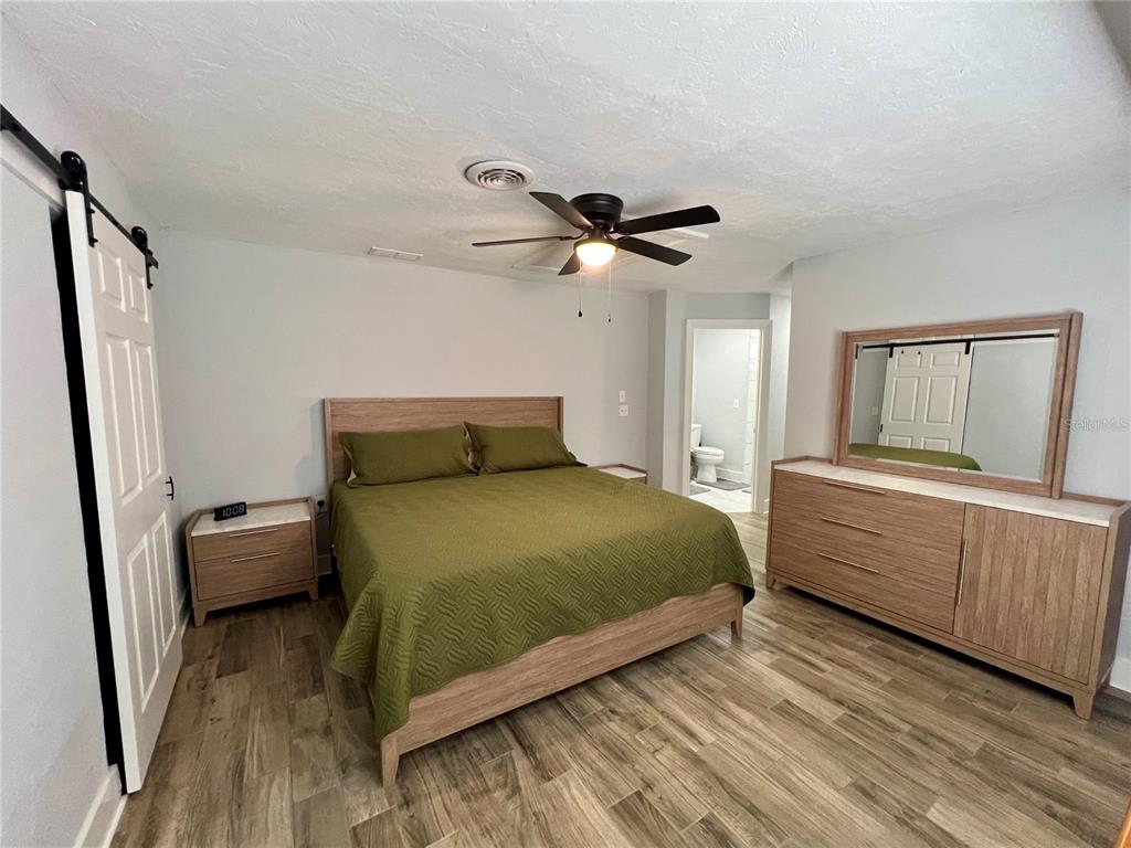 112 Rose Street Venice, FL 34293 - Photo 18 of 33 a bedroom with a bed and a window