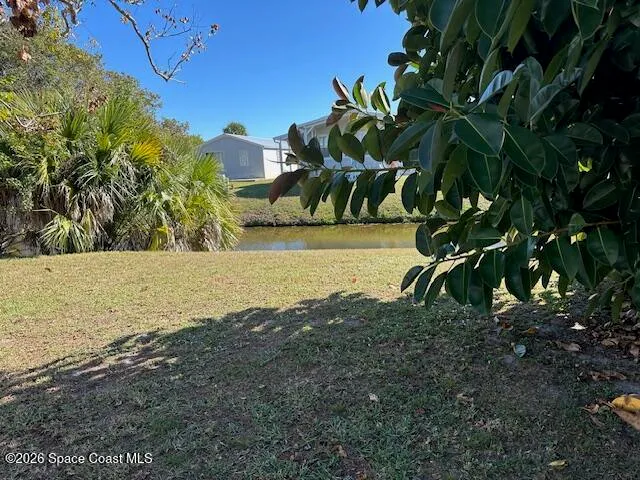 a view of a house with a flower garden