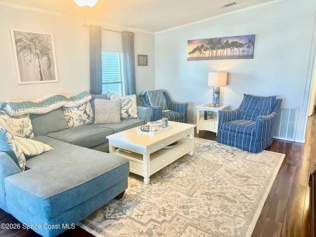 a living room with furniture and a rug