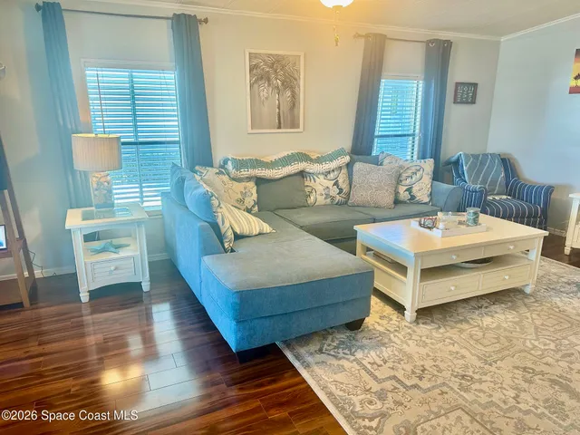 a living room with furniture and a rug