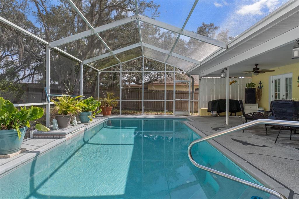 6101 County Line Road Spring Hill, FL 34606 - Photo 2 of 40 a view of a house with a swimming pool