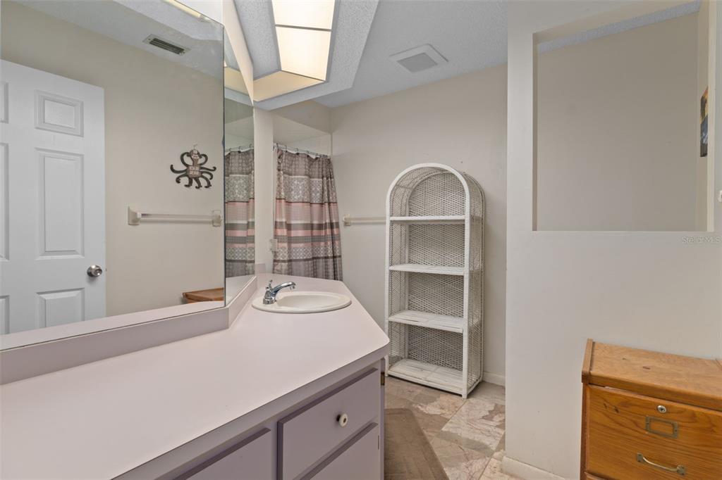 6101 County Line Road Spring Hill, FL 34606 - Photo 22 of 40 a bathroom with a sink a toilet and shower