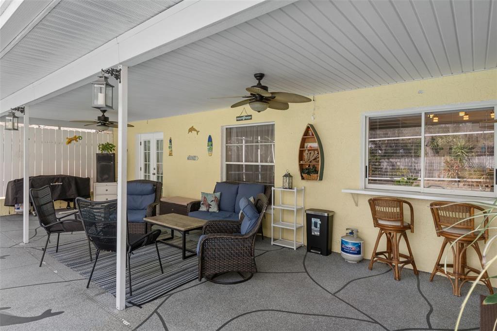 6101 County Line Road Spring Hill, FL 34606 - Photo 33 of 40 a living room with furniture a fireplace and a table