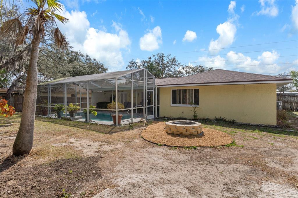 6101 County Line Road Spring Hill, FL 34606 - Photo 39 of 40 a view of a house with backyard and sitting area