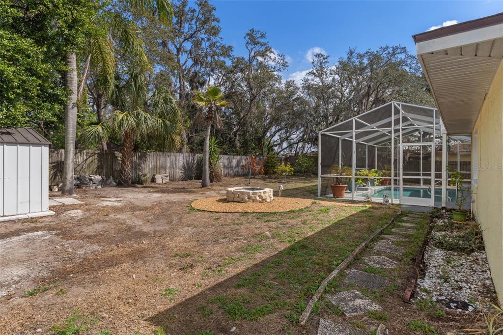 6101 County Line Road Spring Hill, FL 34606 - Photo 40 of 40 a view of a house with backyard and a tree