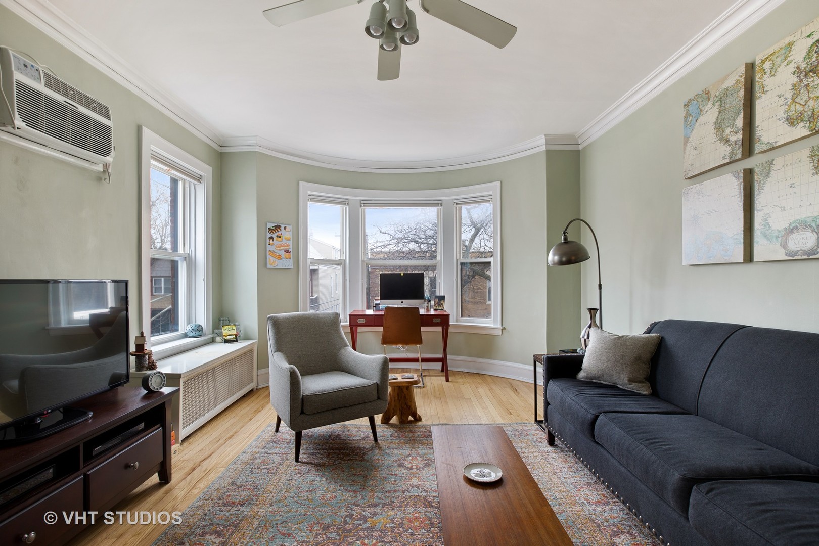 1946 West Patterson Avenue, Unit 2 Chicago, IL 60613 - Photo 2 of 13 a living room with furniture and a flat screen tv