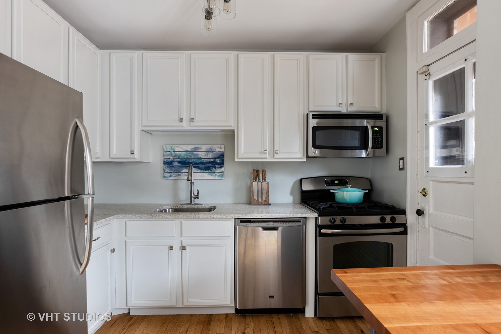1946 West Patterson Avenue, Unit 2 Chicago, IL 60613 - Photo 5 of 13 a kitchen with cabinets stainless steel appliances and a sink