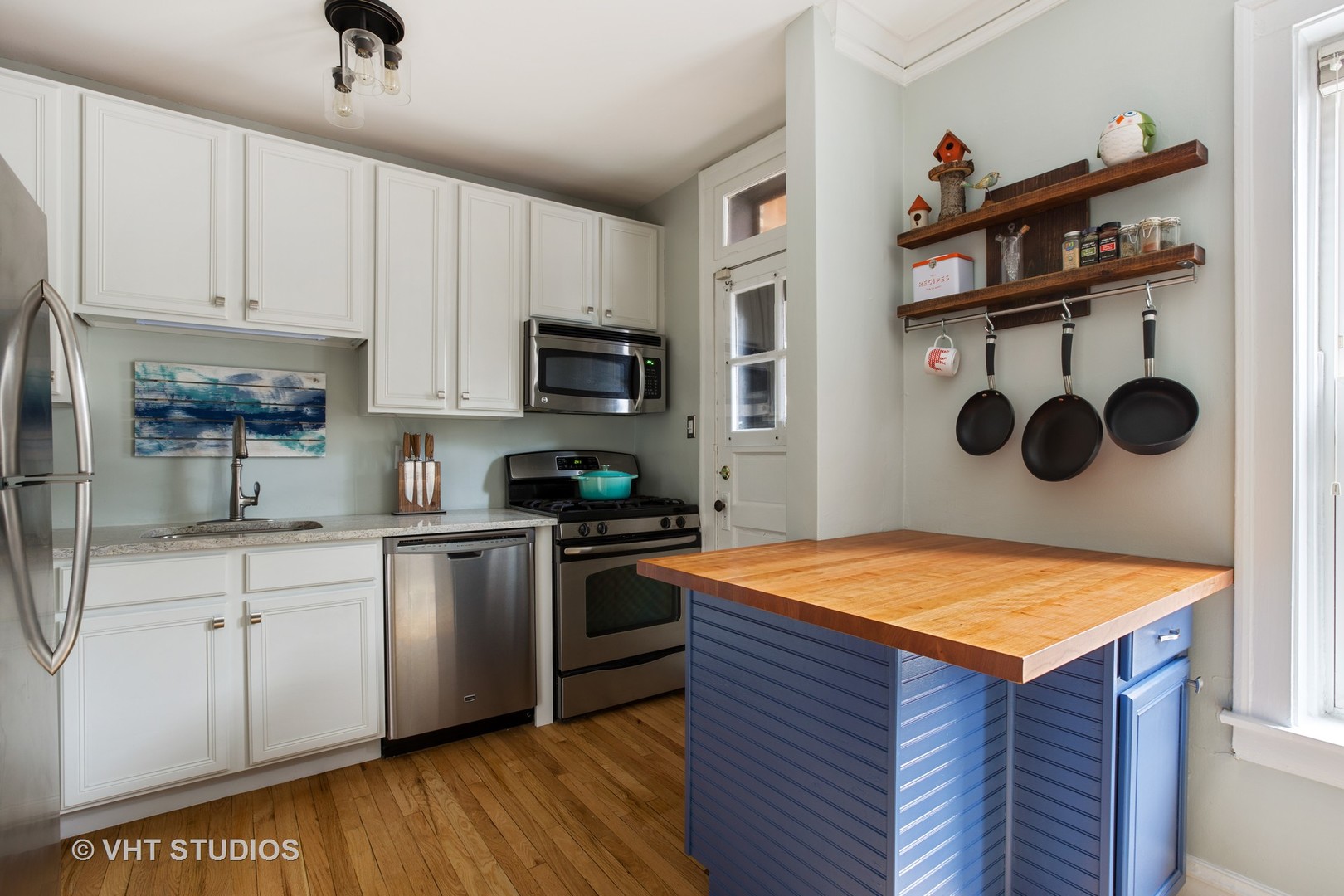 1946 West Patterson Avenue, Unit 2 Chicago, IL 60613 - Photo 6 of 13 a kitchen with stainless steel appliances granite countertop a sink dishwasher stove and oven with cabinets