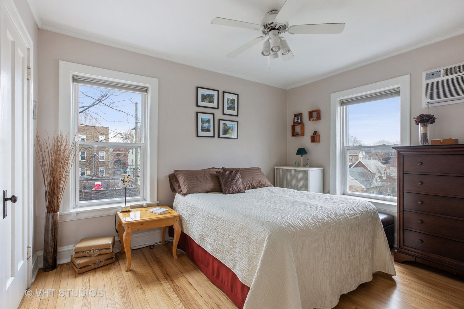 1946 West Patterson Avenue, Unit 2 Chicago, IL 60613 - Photo 9 of 13 a bedroom with a bed and a dresser
