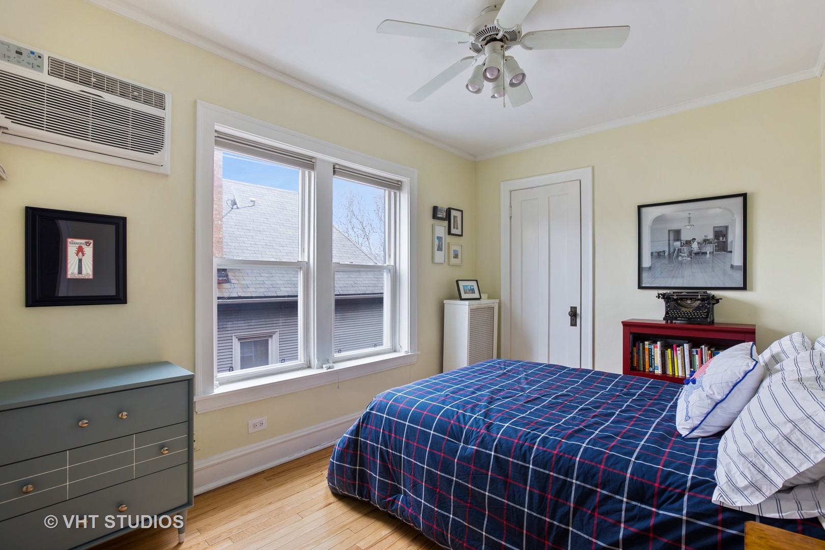 1946 West Patterson Avenue, Unit 2 Chicago, IL 60613 - Photo 10 of 13 a bedroom with a bed and dresser with mirror