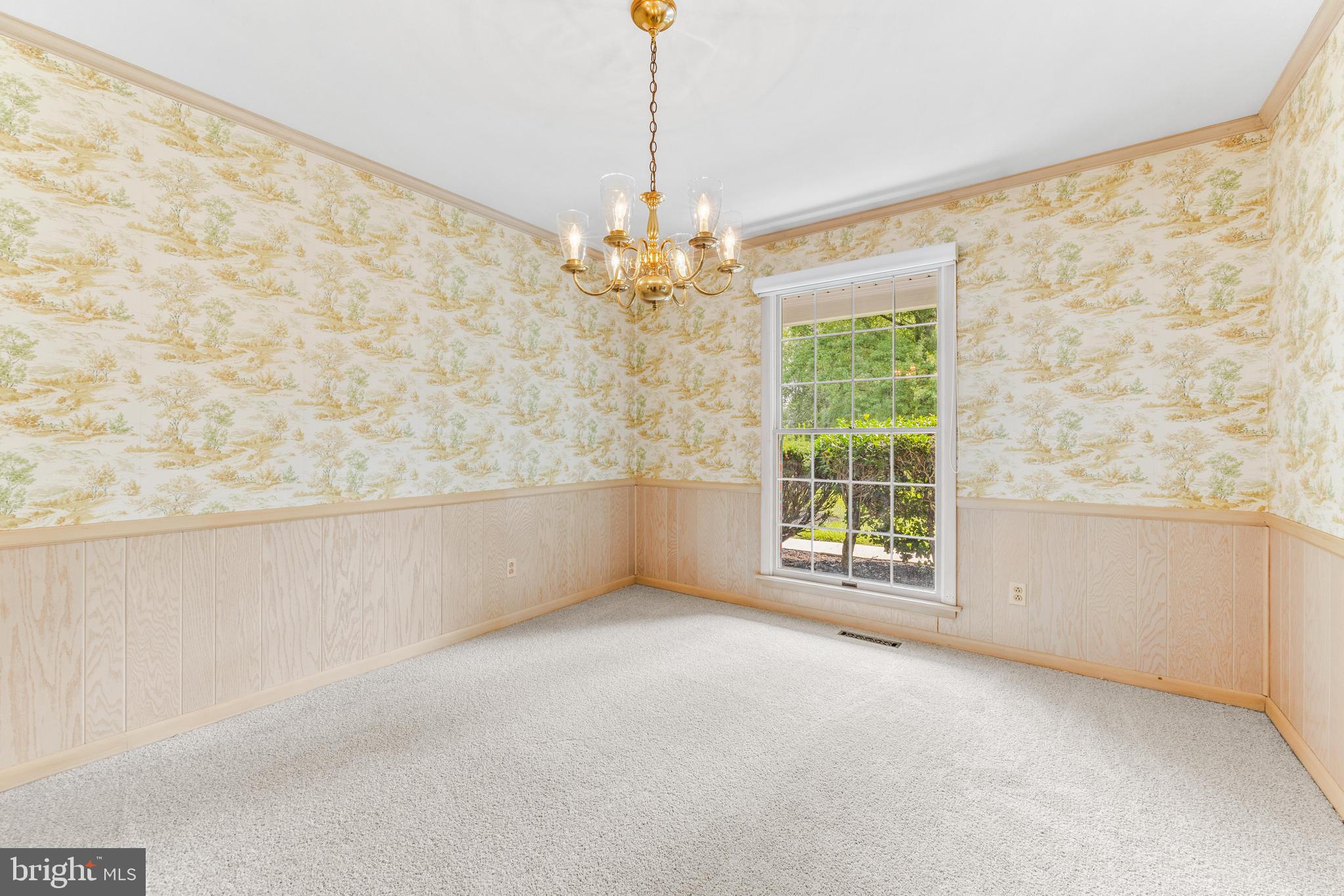 4218 Southfield Road Ellicott City, MD 21042 - Photo 13 of 59 a view of a livingroom with a chandelier a ceiling fan and windows