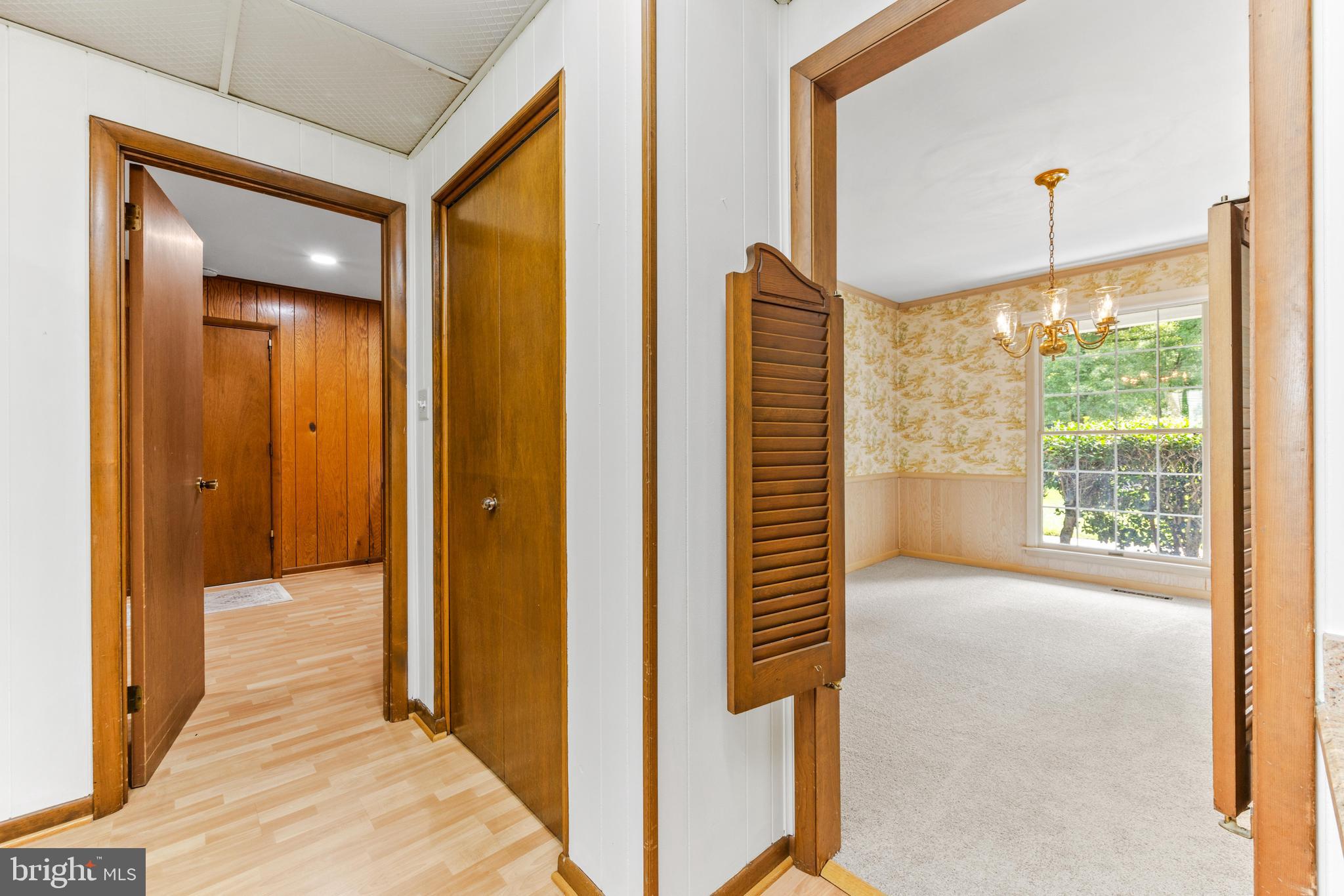 4218 Southfield Road Ellicott City, MD 21042 - Photo 14 of 59 a view of a hallway with wooden floor and a bathroom
