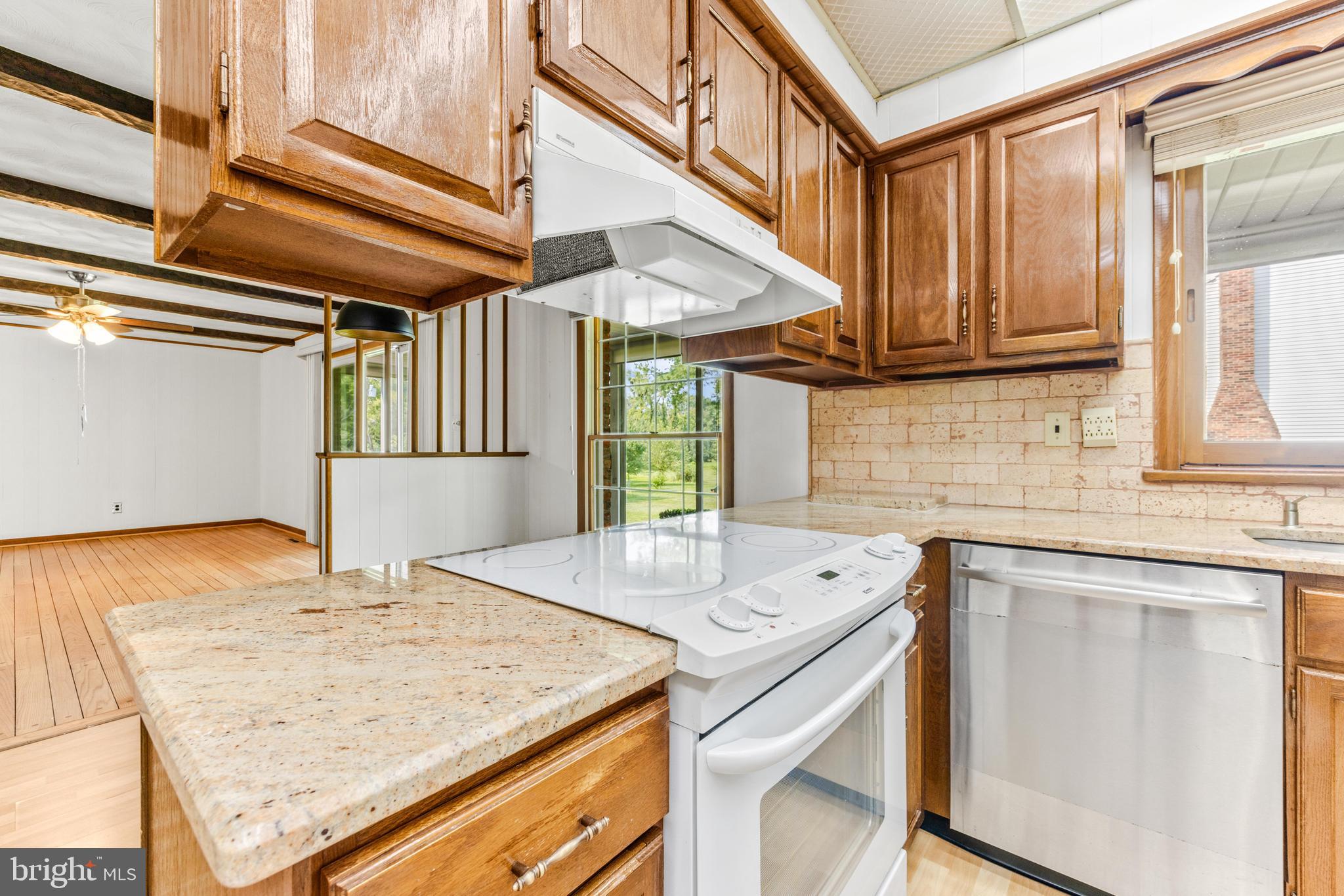 4218 Southfield Road Ellicott City, MD 21042 - Photo 16 of 59 a kitchen with a sink a stove and cabinets