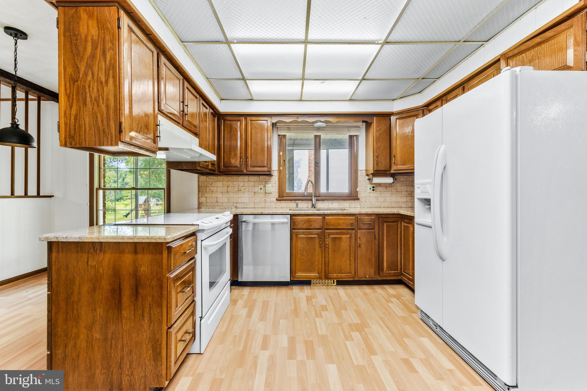 4218 Southfield Road Ellicott City, MD 21042 - Photo 2 of 59 a kitchen with a sink appliances cabinets and a large window