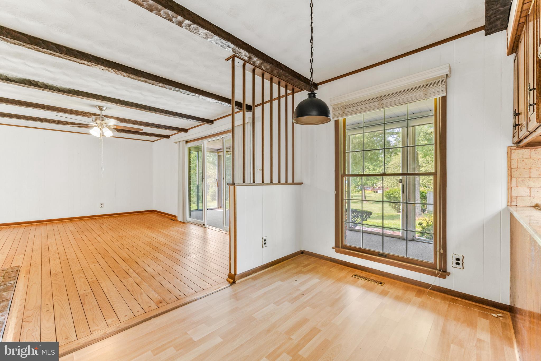 4218 Southfield Road Ellicott City, MD 21042 - Photo 22 of 59 an empty room with wooden floor and windows
