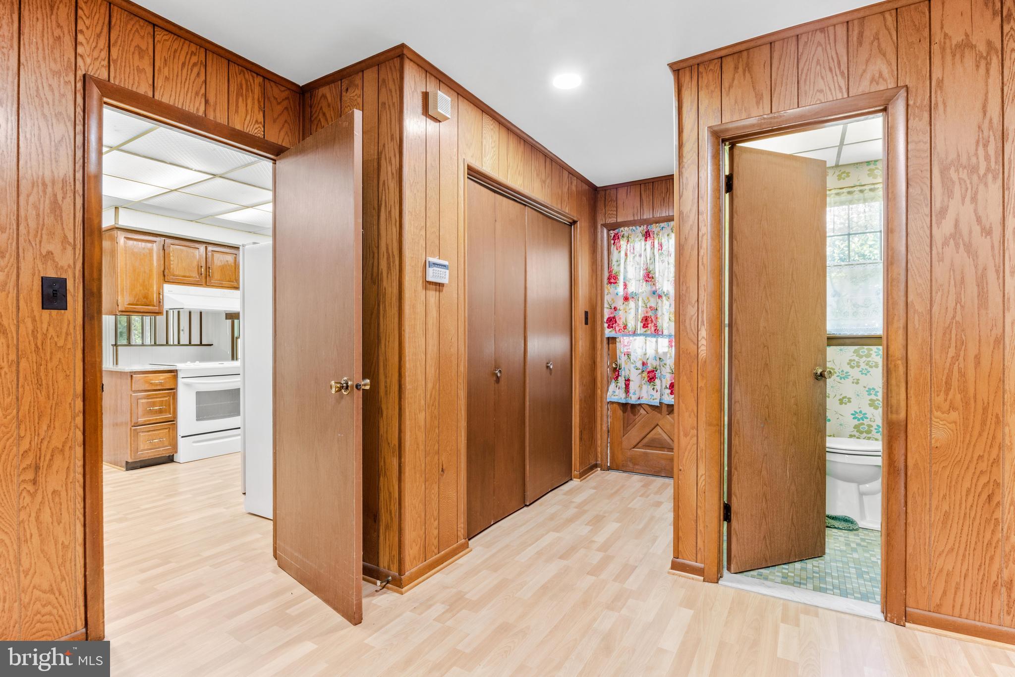 4218 Southfield Road Ellicott City, MD 21042 - Photo 27 of 59 a view of a hallway with wooden floor and bathroom