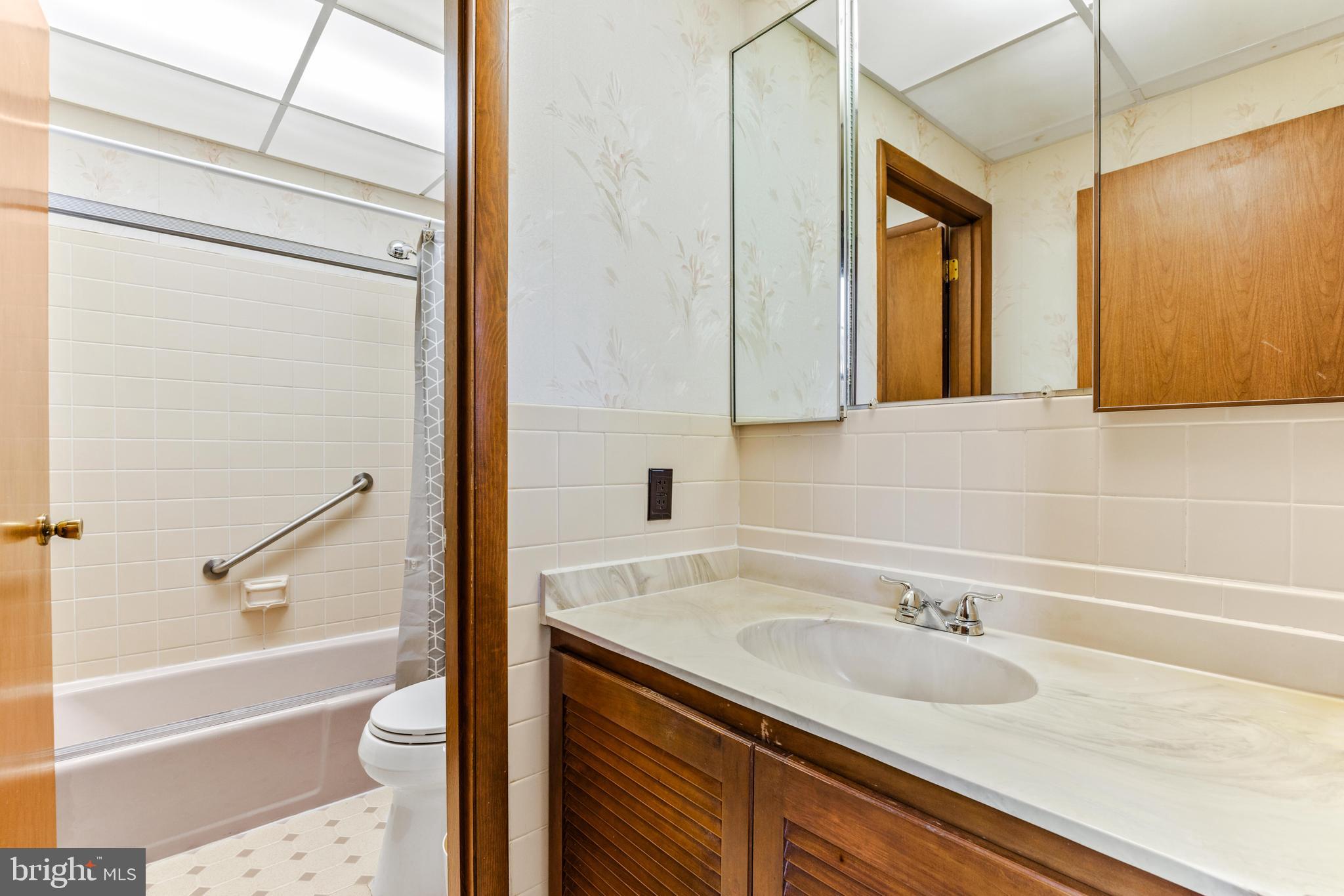 4218 Southfield Road Ellicott City, MD 21042 - Photo 38 of 59 a bathroom with a granite countertop sink toilet and shower