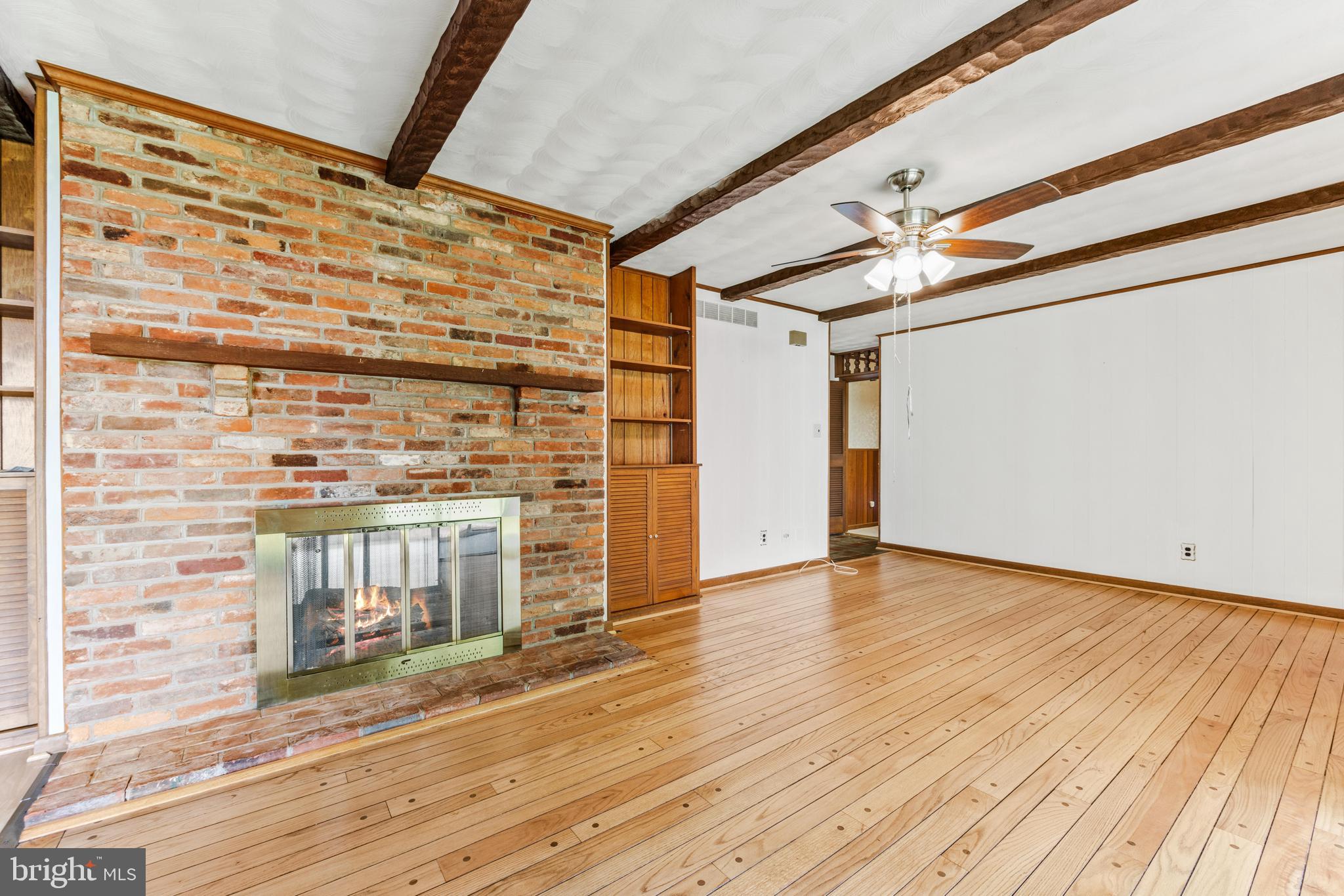 4218 Southfield Road Ellicott City, MD 21042 - Photo 4 of 59 a view of an empty room with wooden floor and a window