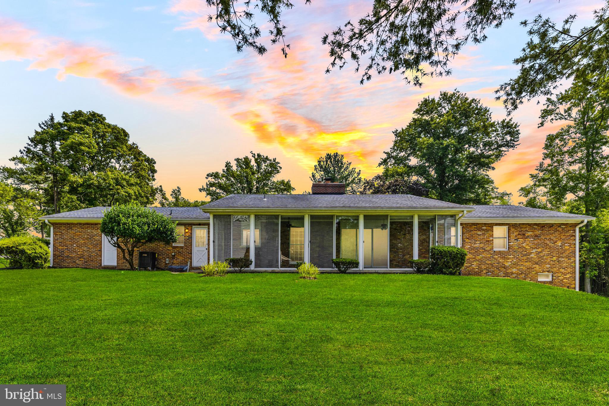 4218 Southfield Road Ellicott City, MD 21042 - Photo 50 of 59 a front view of house with yard and green space