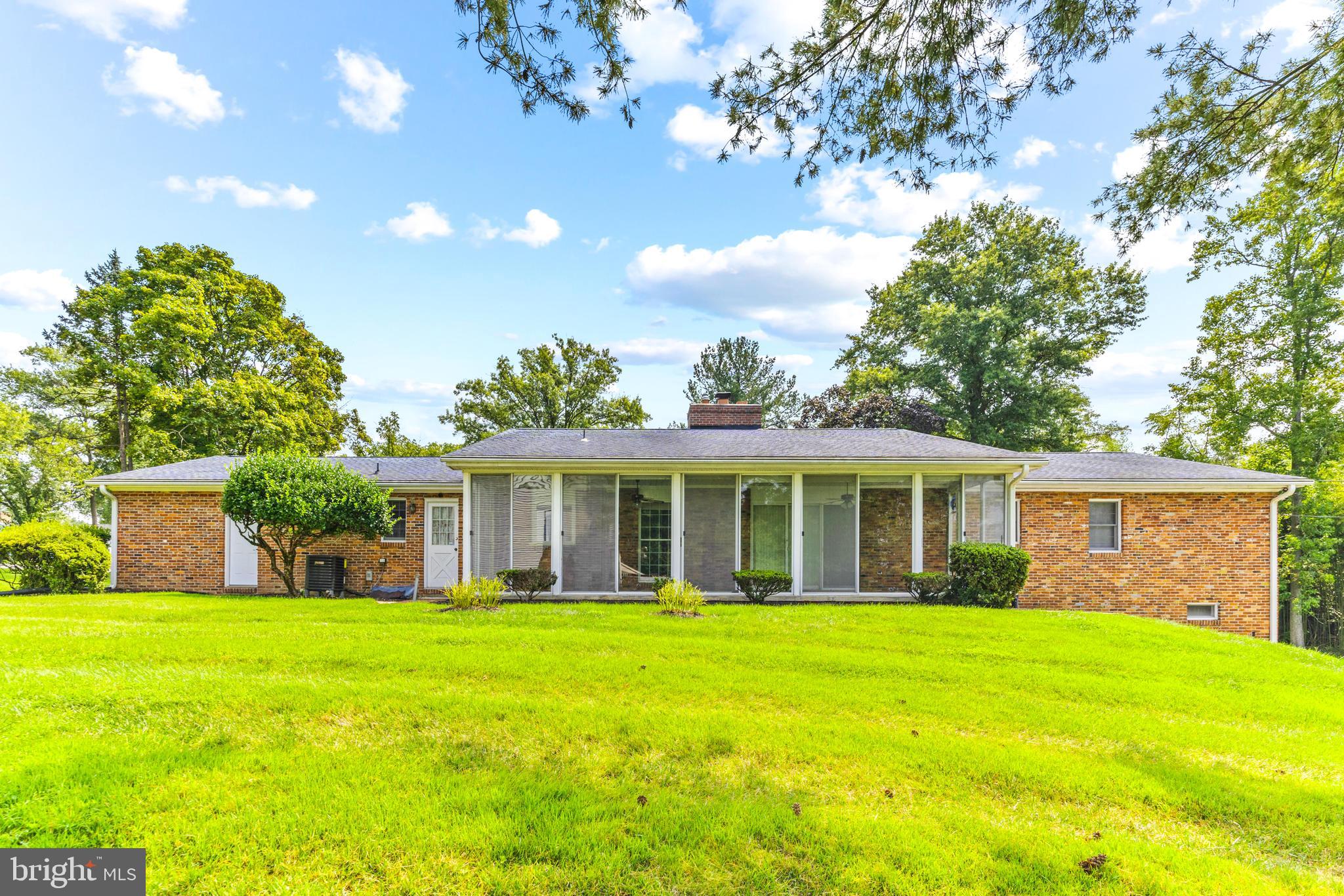 4218 Southfield Road Ellicott City, MD 21042 - Photo 51 of 59 a view of the house that has a yard