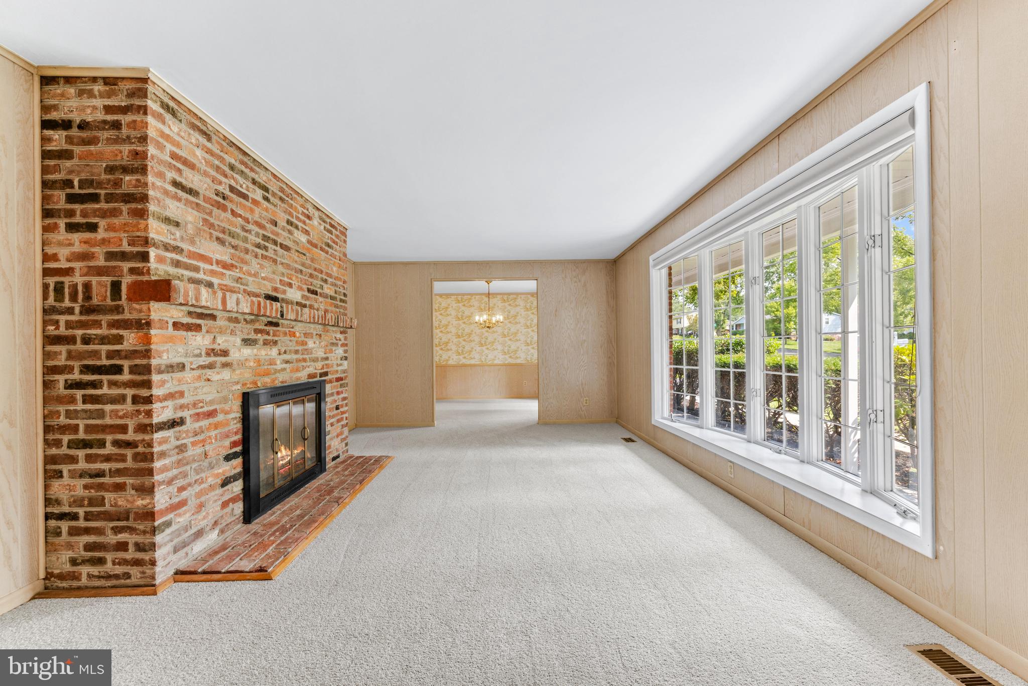 4218 Southfield Road Ellicott City, MD 21042 - Photo 10 of 59 a view of an empty room with a fireplace and a window