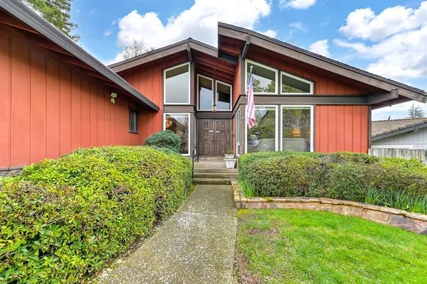 a front view of a house with garden