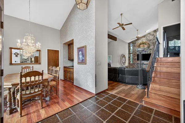 a view of a livingroom with furniture and a kitchen