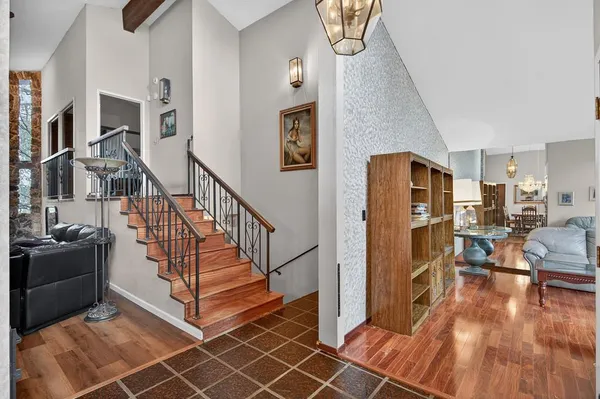 a view of a livingroom with furniture and hardwood floor