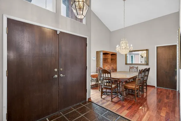 a dining room with furniture and window