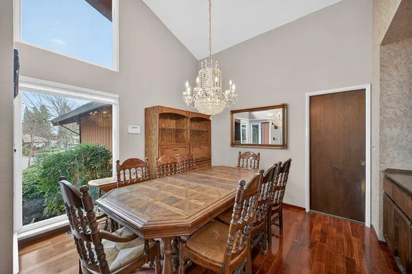 a view of a dining room with furniture window and wooden floor