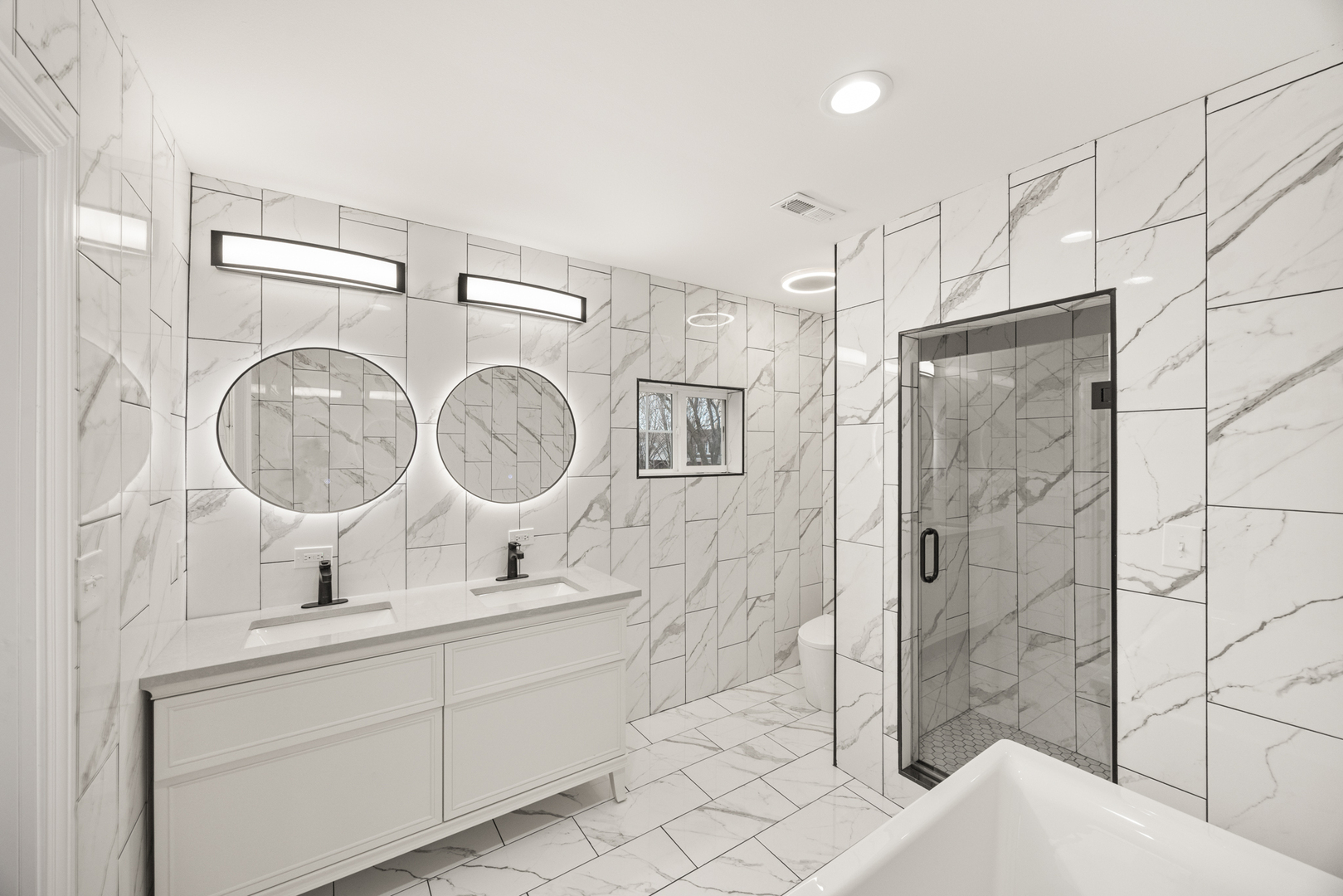 6748 South Indiana Avenue Chicago, IL 60637 - Photo 11 of 19 a bathroom with a double vanity sink mirror toilet and shower