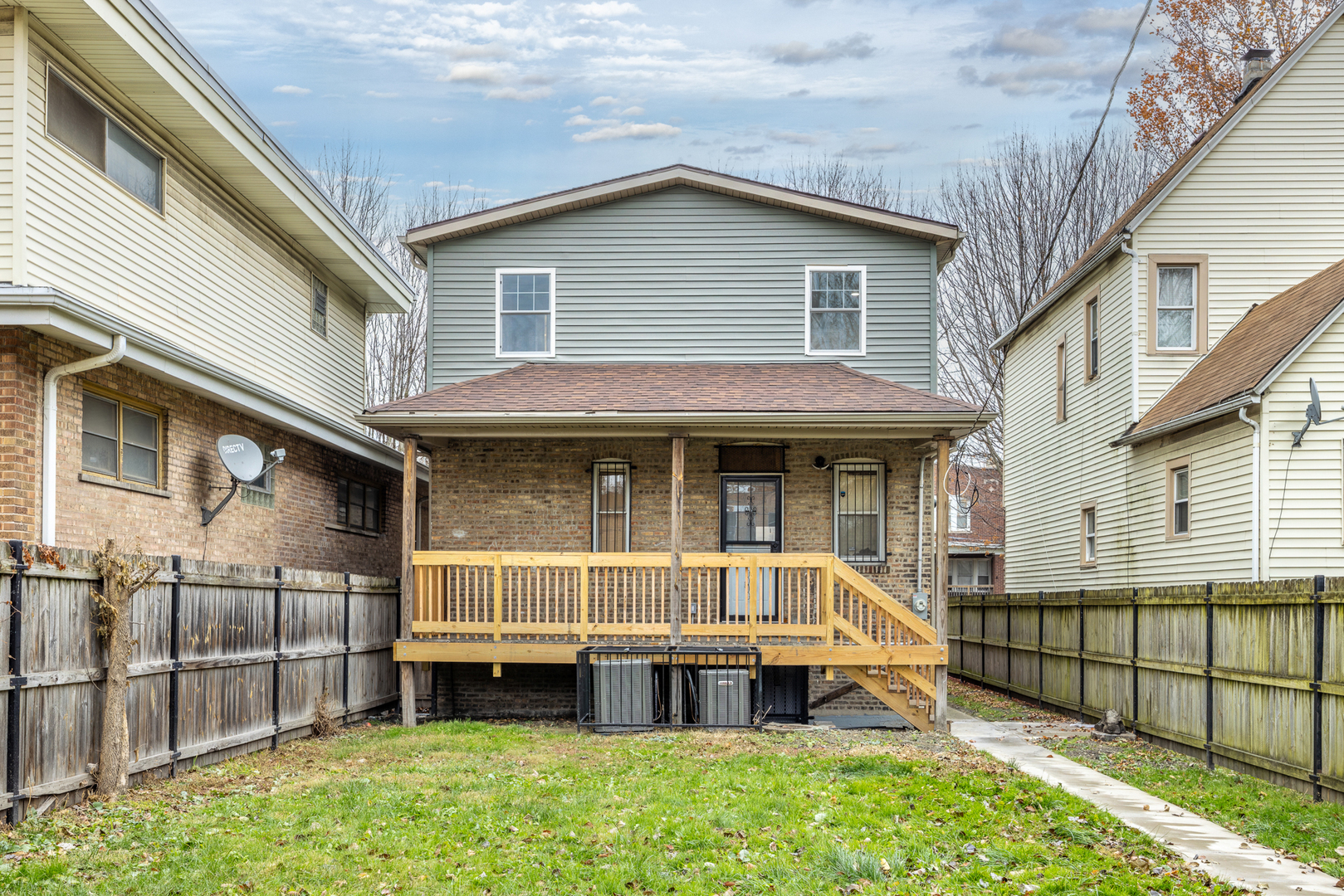 6748 South Indiana Avenue Chicago, IL 60637 - Photo 13 of 19 a view of house with a yard outdoor seating and deck
