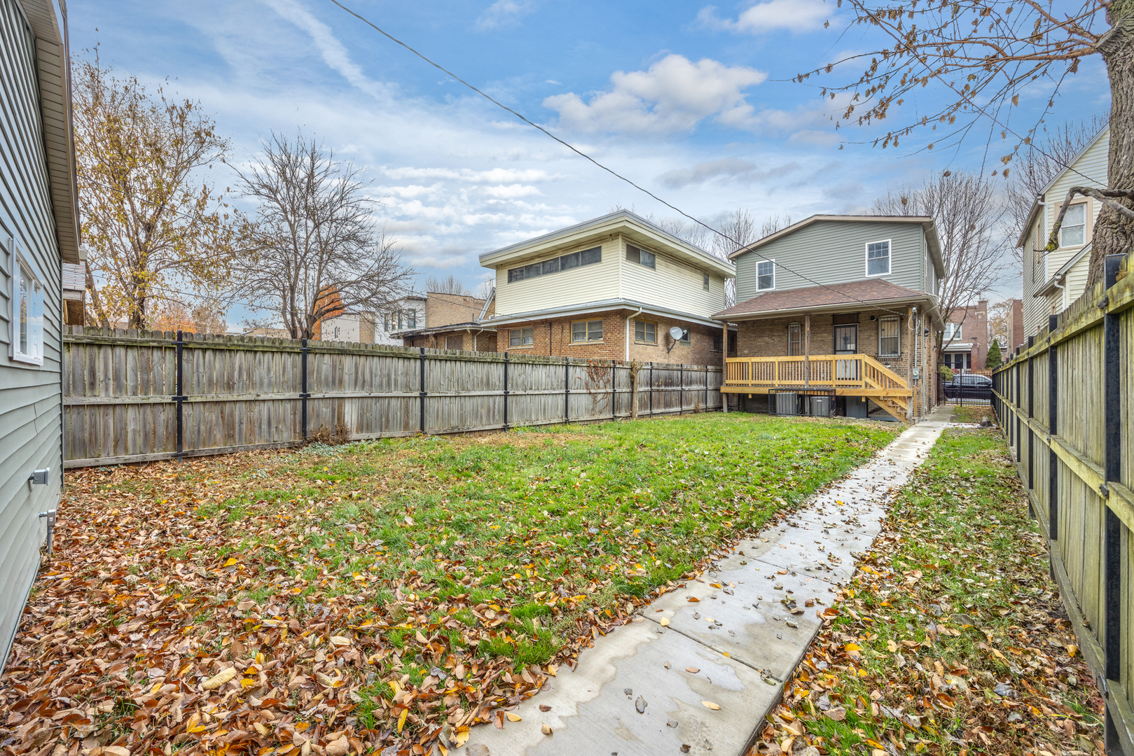 6748 South Indiana Avenue Chicago, IL 60637 - Photo 15 of 19 a view of a brick house with a large trees