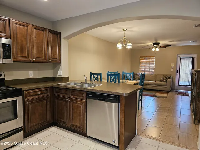 a spacious bedroom with a bed and a table