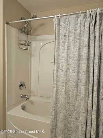 a view of a swimming pool and lounge chair