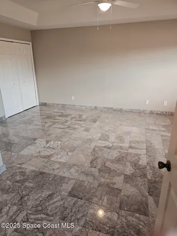 a view of a yard with large trees