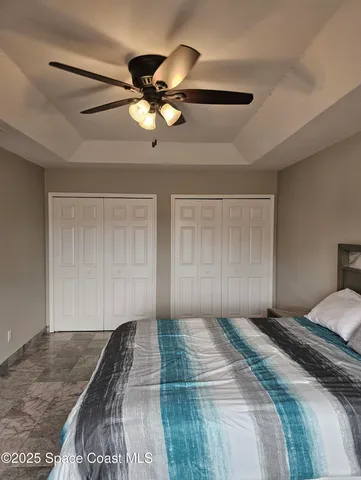 a view of a garden with a building in the background