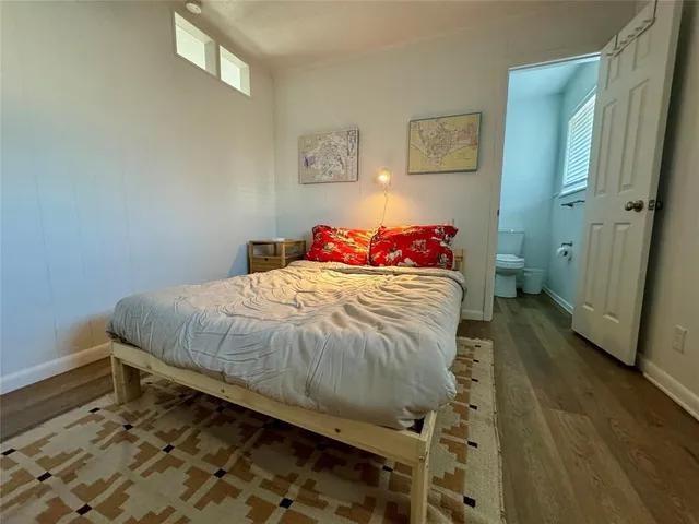 a bedroom with a bed and a walk in closet