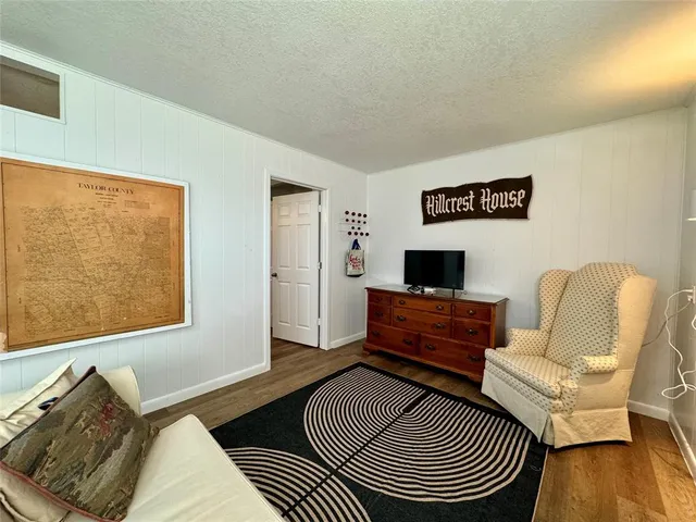 a living room with furniture and a rug