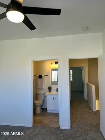 a view of a hallway with a chandelier