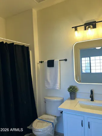 an empty room with closet and window