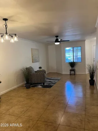 a view of a lobby with furniture and a chandelier