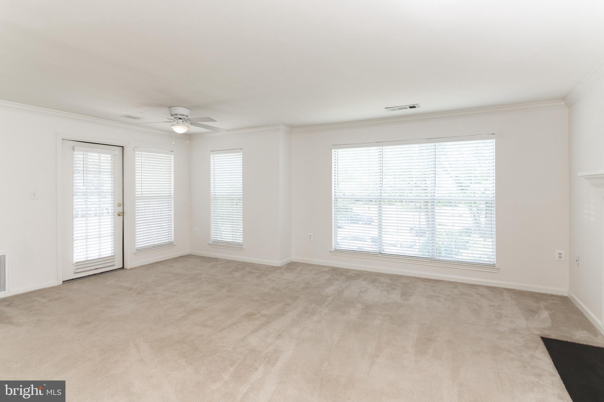 20958 Timber Ridge Terrace, Unit 201 Ashburn, VA 20147 - Photo 16 of 25 a view of an empty room with a window