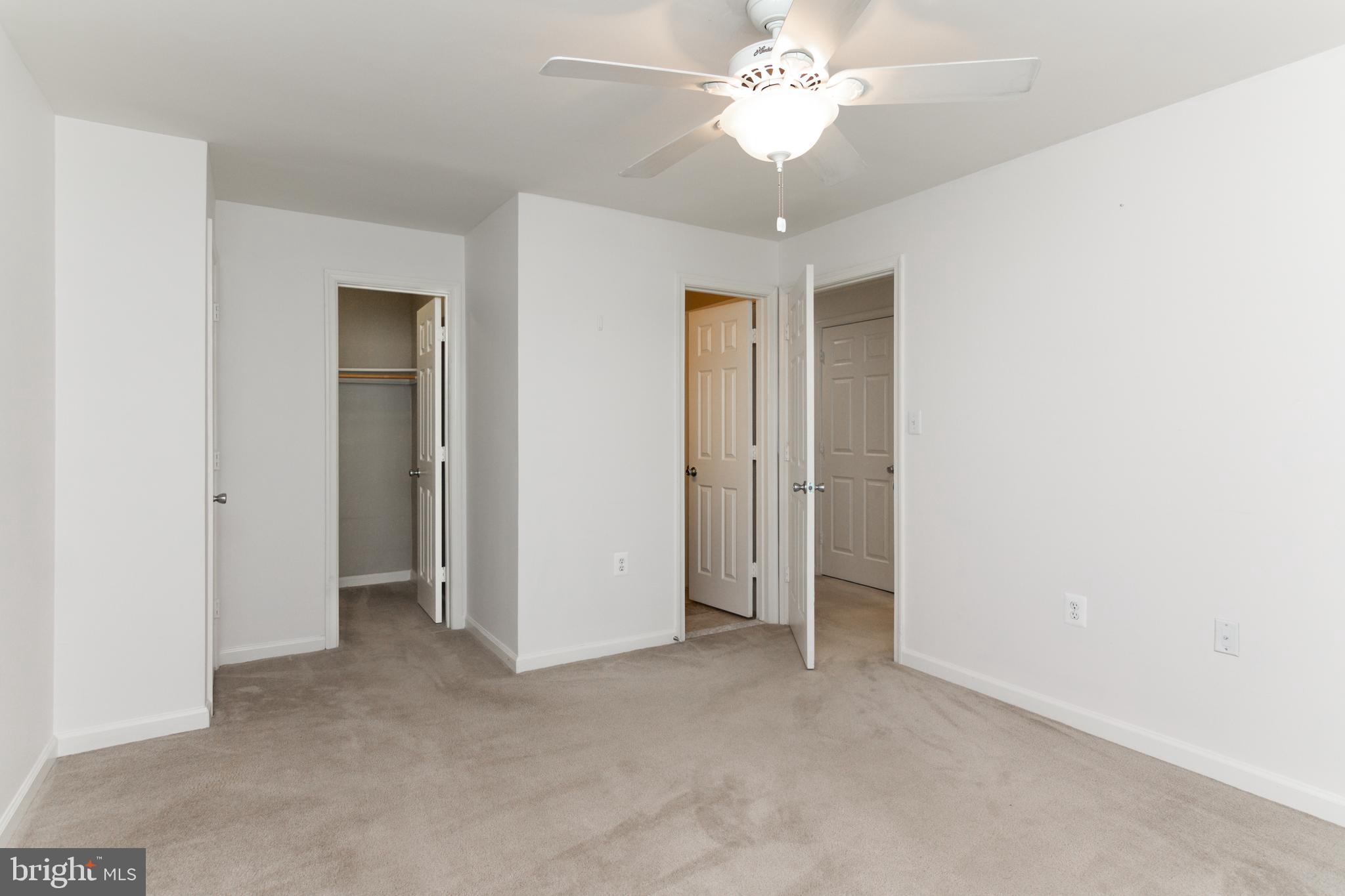 20958 Timber Ridge Terrace, Unit 201 Ashburn, VA 20147 - Photo 9 of 25 a view of an empty room with a window