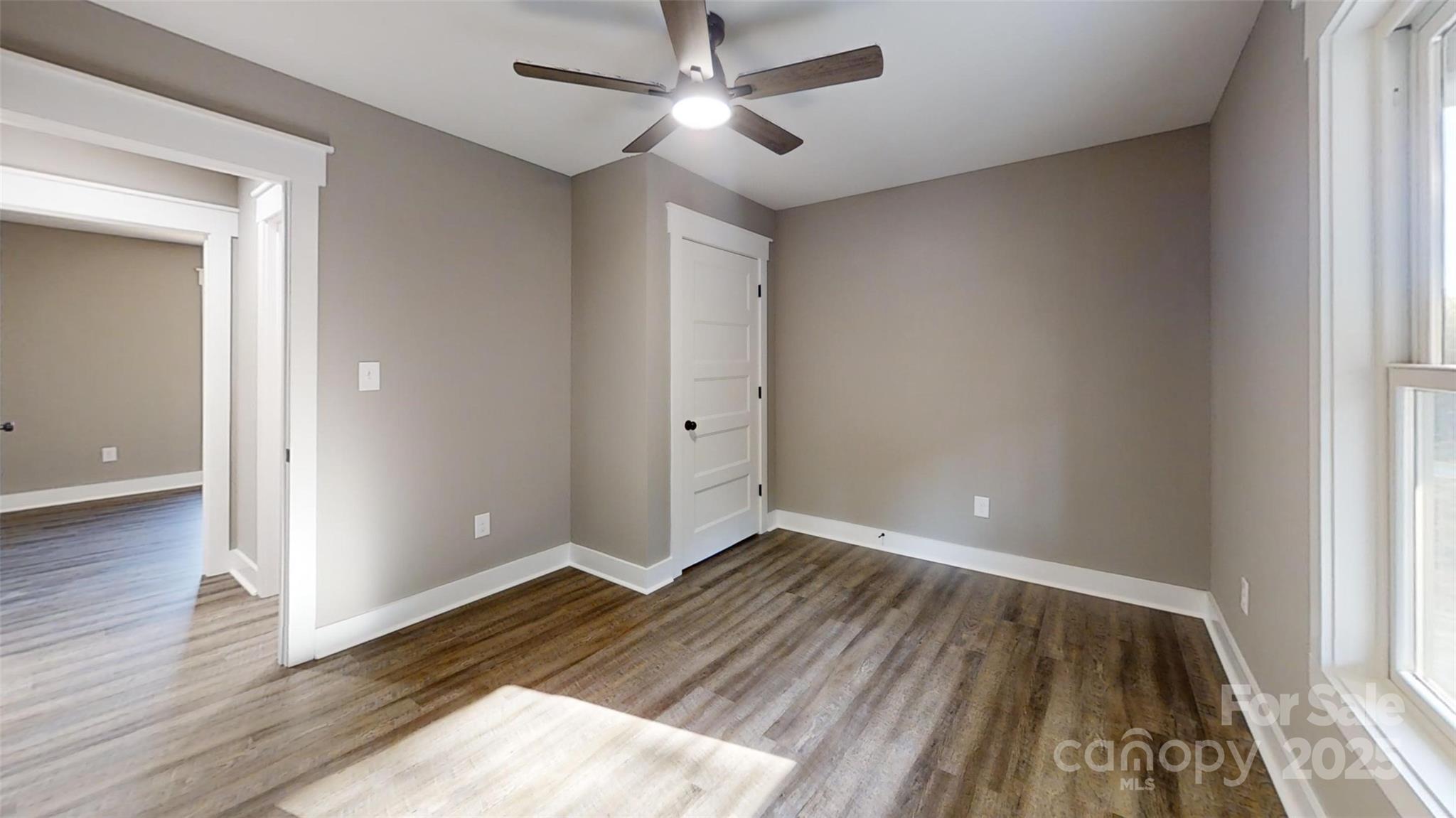 268 Vic Randall Road Lawndale, NC 28090 - Photo 11 of 22 wooden floor in an empty room with a window